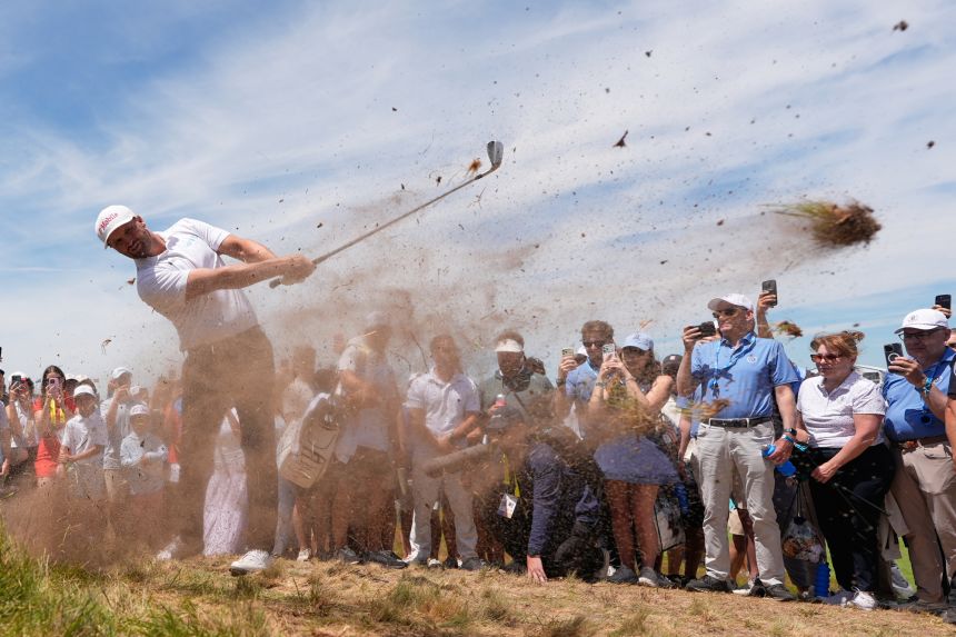 Wyndham Clark hits from the rough on the 14th hole during the second round of the US Open at Shinnecock Hills Golf Club in Southampton, New York on Friday.