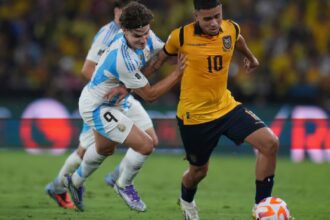 Argentina's Julian Alvarez (left) battles for the ball during a World Cup 2026 qualifying soccer match at Banco Pichincha stadium in Guayaquil, Ecuador, Tuesday, Sept. 9, 2025. (AP Photo)