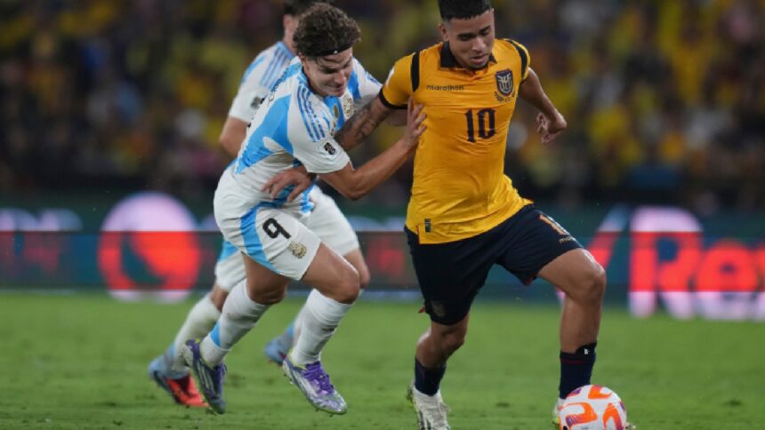 Argentina's Julian Alvarez (left) battles for the ball during a World Cup 2026 qualifying soccer match at Banco Pichincha stadium in Guayaquil, Ecuador, Tuesday, Sept. 9, 2025. (AP Photo)