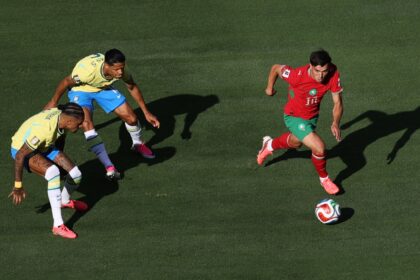 Morocco's Brahim Diaz dribbles past Brazil's Raphinha and Douglas Santos during the FIFA World Cup 2026 match. (AP)