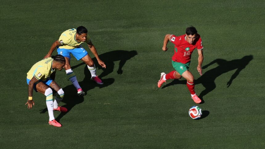 Morocco's Brahim Diaz dribbles past Brazil's Raphinha and Douglas Santos during the FIFA World Cup 2026 match. (AP)