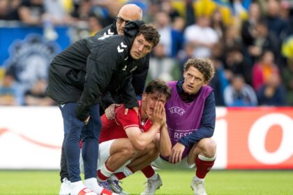 Denmark's Joakim Maehle, Andreas Christensen, and Jens Stage react after Christian Eriksen collapsed on the field during the international friendly soccer match between Denmark and Ukraine in Odense, Denmark, Sunday, June 7, 2026. (Bo Amstrup/Ritzau Scanpix via AP)