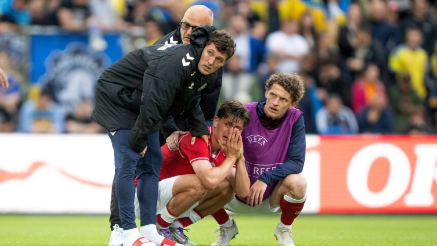 Denmark's Joakim Maehle, Andreas Christensen, and Jens Stage react after Christian Eriksen collapsed on the field during the international friendly soccer match between Denmark and Ukraine in Odense, Denmark, Sunday, June 7, 2026. (Bo Amstrup/Ritzau Scanpix via AP)