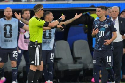 VAR Carlos del Cerro Grande asked on-field Dutch referee Danny Makkelie to go to the pitch-side TV screen. Makkelie subsequently revoked his decision and gave a yellow card to Almiron for ‘simulation’, a euphemism for diving. (AP Photo)