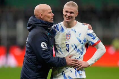 Erling Haaland and head coach Stale Solbakken celebrate after the 2026 World Cup Group I qualifier match against Italy (AP Photo)