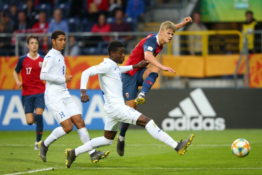 Erling Haaland finishes one of the nine goals he scored for Norway during an Under-20 World Cup match against Honduras in 2019.