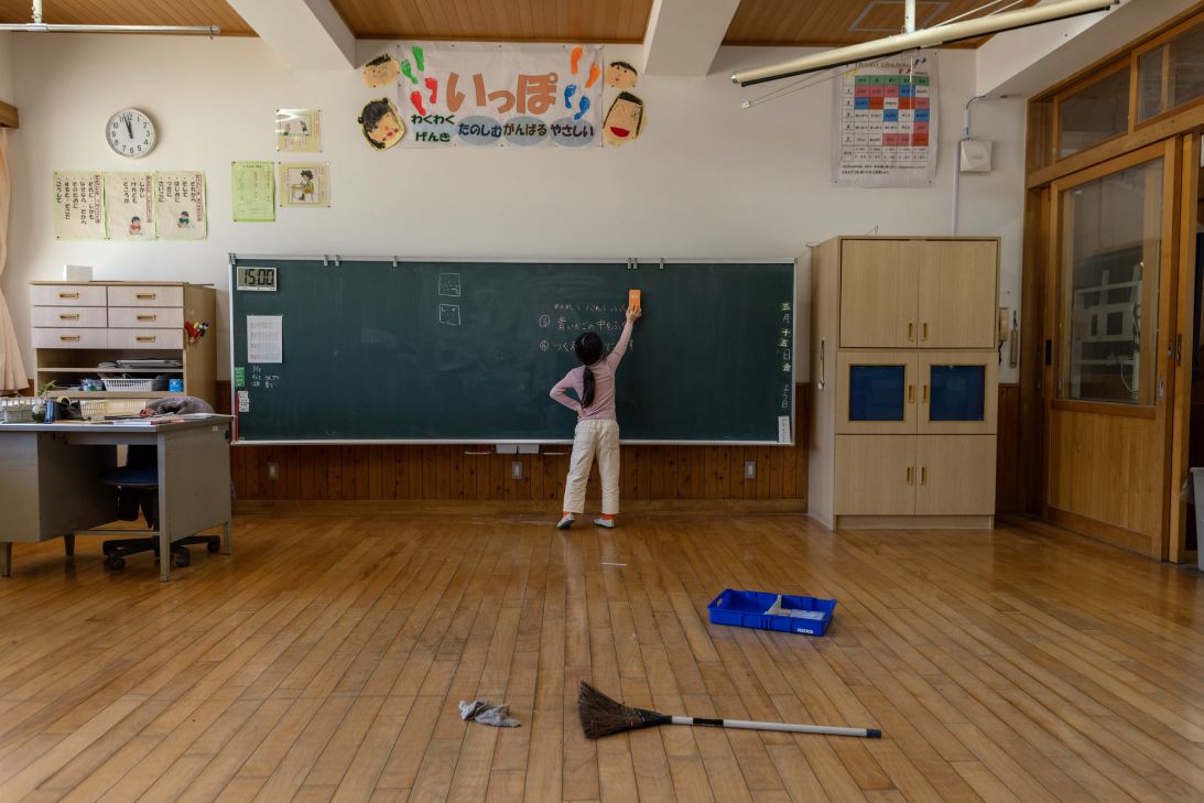 A second-grade student cleans the classroom at Sakiyama elementary school in Tamba, Hyogo Prefecture, Japan, on March 15, 2024.