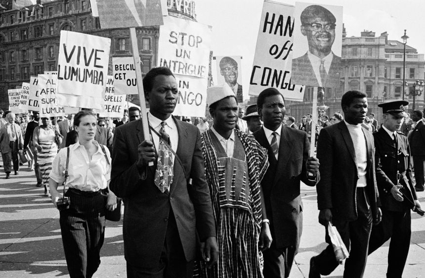 Protesters carrying placards in support of Lumumba in Trafalgar Square, London, September 1960. Lumumba was deposed as the prime minister before before tortured and executed.