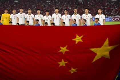 Chinese players line up before a World Cup qualifying match in June 2025.