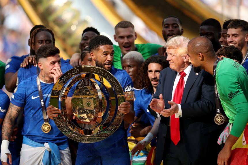 President Donald Trump standing on stage with the squad of Club World Cup winner Chelsea last summer.