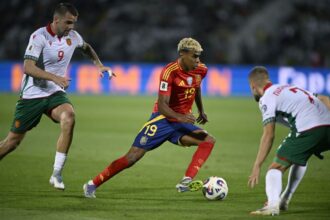 Spain's Lamine Yamal is defended by two Bulgarian players during a World Cup qualifier in September.