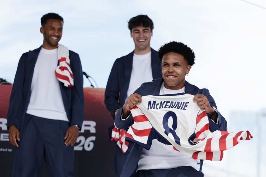 Weston McKennie poses with his US jersey during a World Cup roster reveal on May 26.