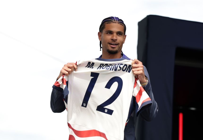 Miles Robinson poses with his World Cup jersey during the USMNT roster reveal on May 26 in New York City.
