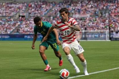 Christian Pulisic of United States controls the ball wile under pressure from Iliman Ndiaye of Senegal on Sunday.