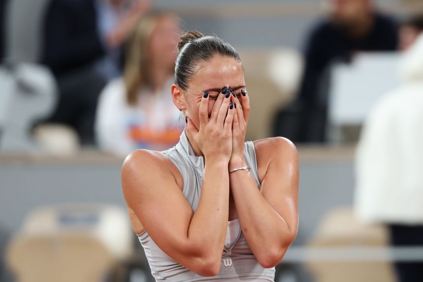 Marta Kostyuk reacts after victory over Elina Svitolina in the French Open quarterfinals.