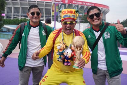 Fans pose for photos outside of the stadium in Mexico City on Tuesday.