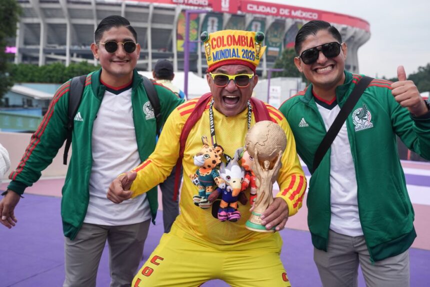 Fans pose for photos outside of the stadium in Mexico City on Tuesday.