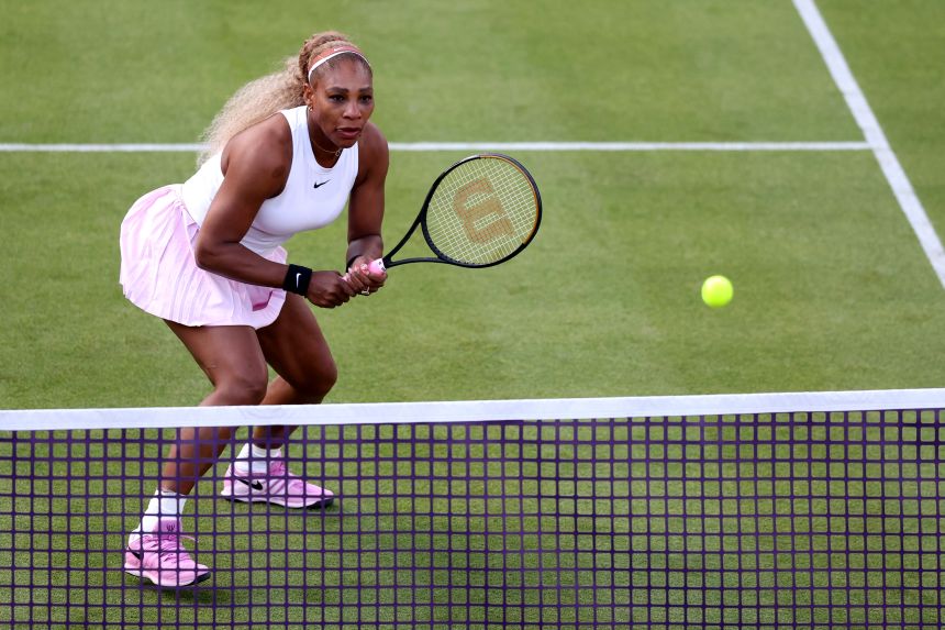 Serena Williams plays at the net during Tuesday's match.
