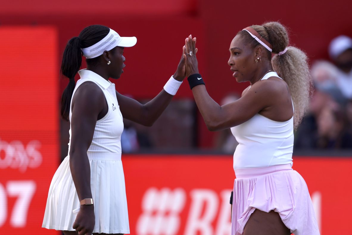 Williams celebrates a point with Victoria Mboko on their way to winning a doubles match at the Queen's Club Championships in June 2026. It was <a href="https://www.cnn.com/2026/06/09/sport/serena-williams-tennis-return/">Williams' first professional match in nearly four years</a>.