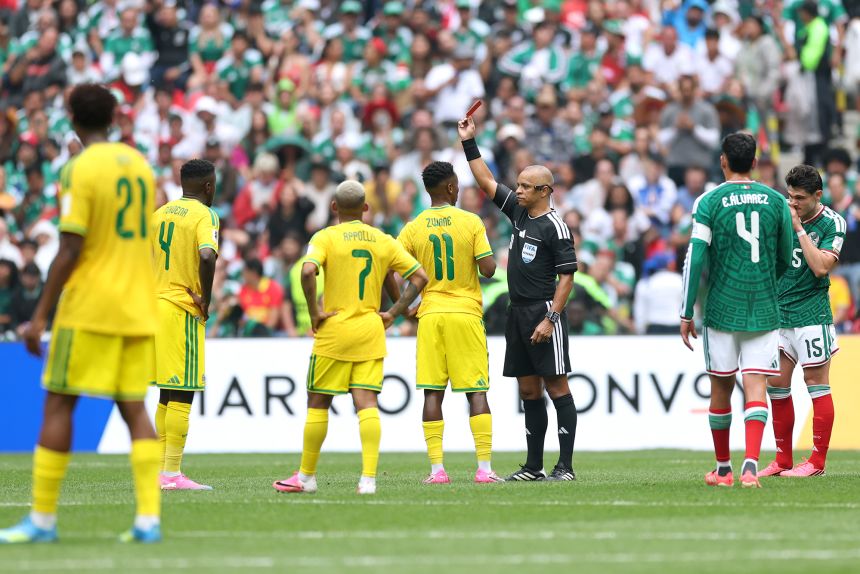 Referee Wilton Sampaio was seeing red all day, handing out a record three red cards in the World Cup opener.