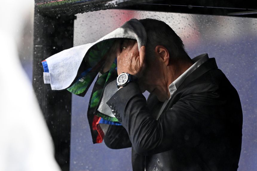 Didier Deschamps got quite drenched during France's 3-0 win over Iraq on Monday.