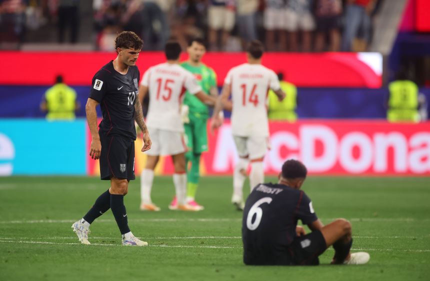 Pulisic and Auston Trusty react after the full-time whistle.