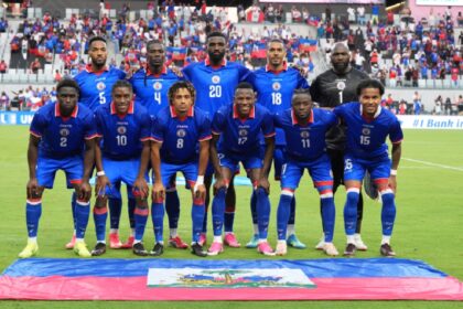 Haiti national soccer team players pose for a team photo at the start of an international friendly soccer match against Peru, Friday, June 5, 2026, in Miami. (AP Photo/Rebecca Blackwell)