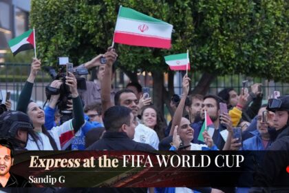 Iran fans wave as players arrive in Tijuana, Mexico, for the World Cup. (AP Photo/Gregory Bull)