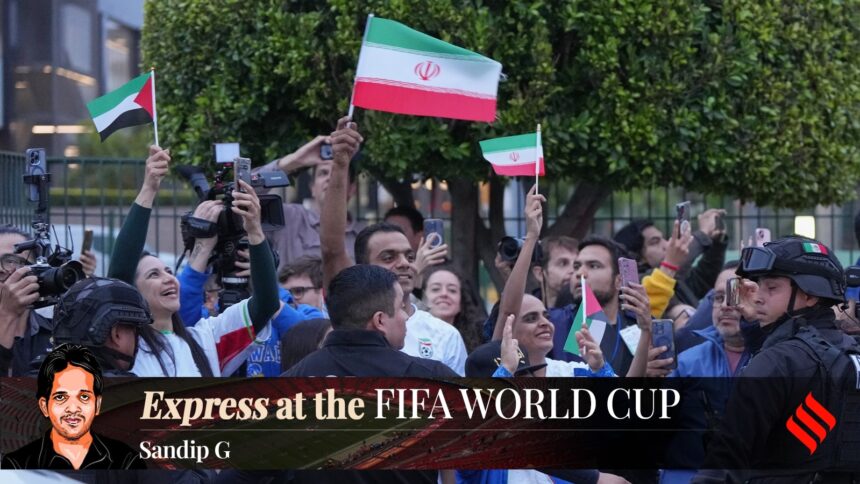 Iran fans wave as players arrive in Tijuana, Mexico, for the World Cup. (AP Photo/Gregory Bull)