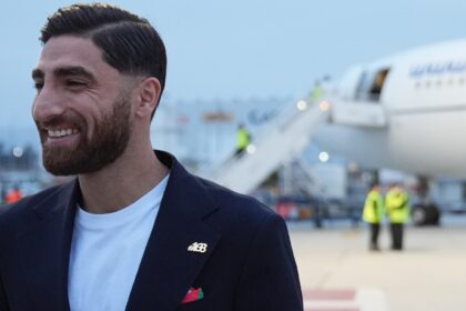 Iran's Alireza Jahanbakhsh smiles as he arrives with his teammates for the World Cup soccer tournament in Tijuana, Mexico, Sunday, June 7, 2026. (AP Photo)