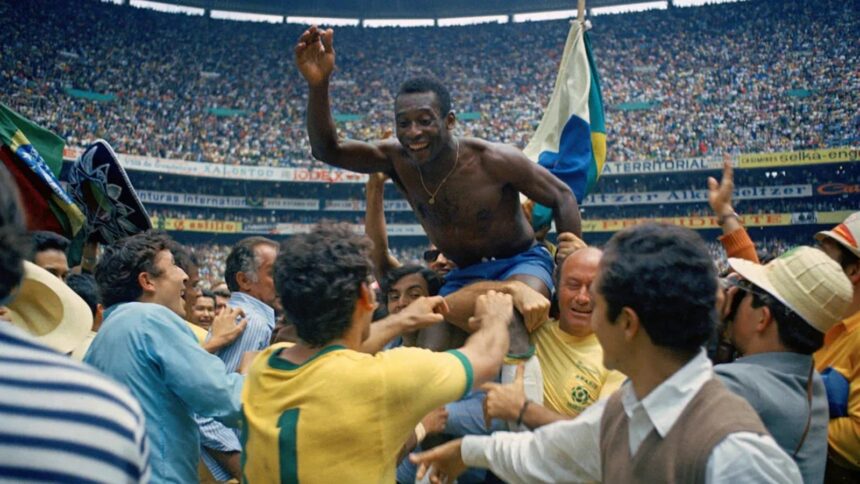 Pelé is hoisted on the shoulders of his teammates after Brazil won the 1970 World Cup soccer final against Italy, 4-1, in Mexico City’s Estadio Azteca. (AP)