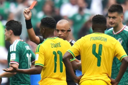 South Africa's Themba Zwane is shown a red card from referee Wilton Sampaio in the second half during the World Cup Group A soccer match between Mexico and South Africa in Mexico City. (AP Photo)