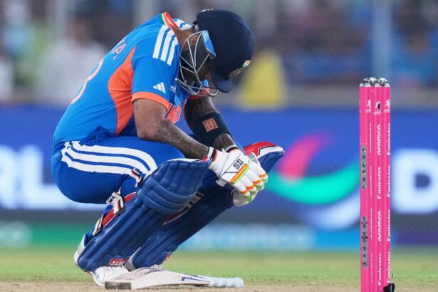 India's captain Suryakumar Yadav takes a breather after getting hit by a delivery from South Africa's Lungi Ngidi during the T20 World Cup cricket match between India and South Africa in Ahmedabad. (AP Photo)