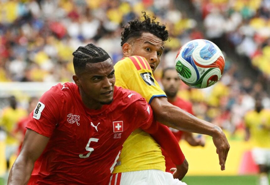 Switzerland's Manuel Akanji and Colombia's Luis Suarez battle for the ball on Tuesday.