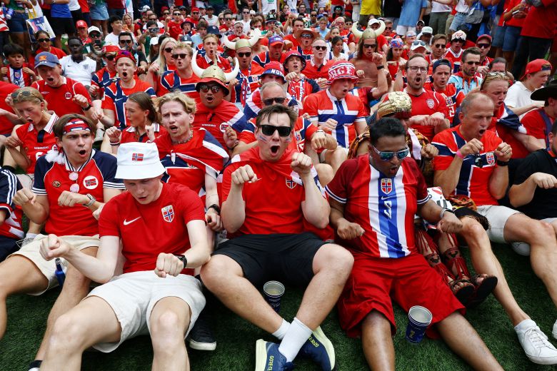 Norway fans do a "Viking row" together before the quarterfinal match against England.