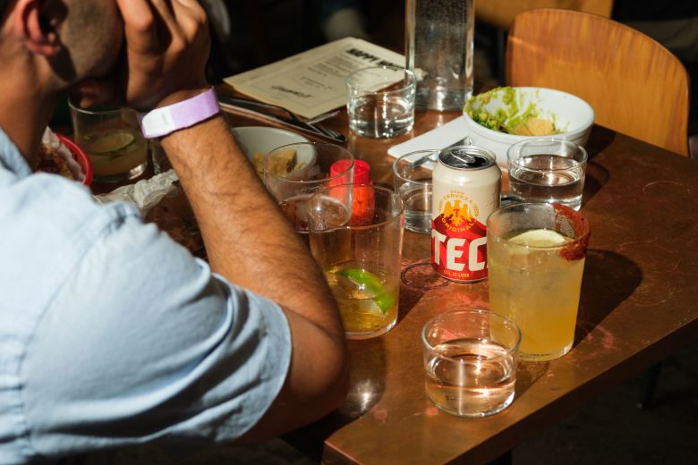 Fans have drinks and beers as they watch the match on July 10.