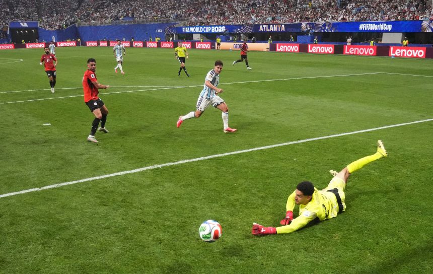 Egypt's Mostafa Shobeir saves a shot on goal by Argentina's Julián Álvarez.
