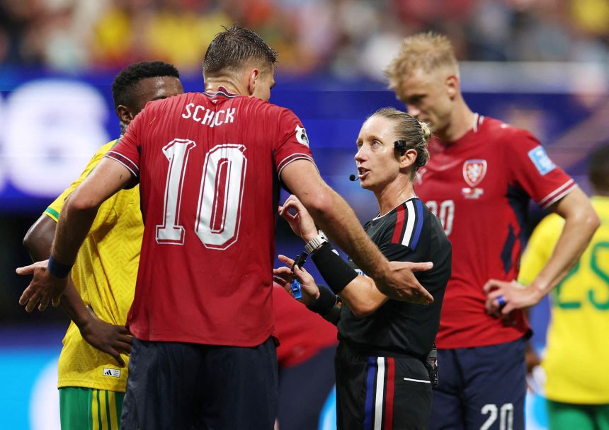 Tori Penso discusses a decision with the Czech Republic's Patrik Schick during Penso's first 2026 World Cup match.