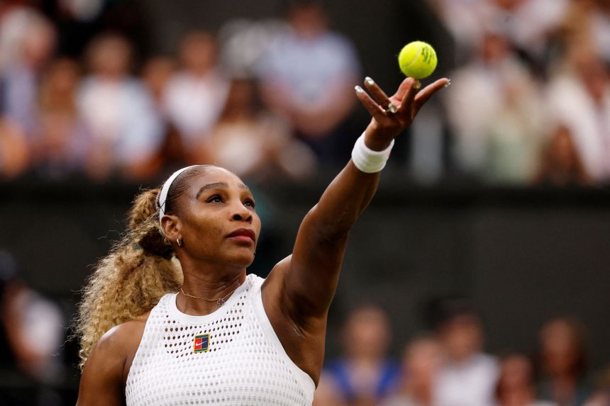 Serena Williams tosses a ball for a serve on Tuesday.
