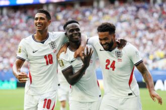 England's Bukayo Saka celebrates scoring their fifth goal to complete a hat-trick with Jude Bellingham and Reece James during Saturday's World Cup third place match.