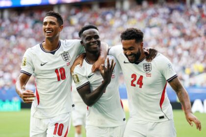 England's Bukayo Saka celebrates scoring their fifth goal to complete a hat-trick with Jude Bellingham and Reece James during Saturday's World Cup third place match.