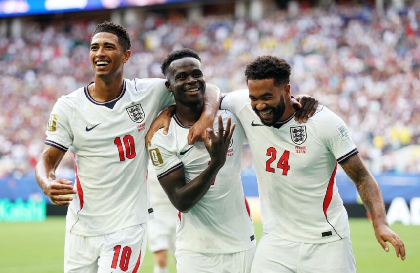 England's Bukayo Saka celebrates scoring their fifth goal to complete a hat-trick with Jude Bellingham and Reece James during Saturday's World Cup third place match.