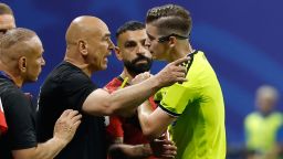 Egypt head coach Hossam Hassan argues with referee Francois Letexier, of France, during the World Cup round of 16 soccer match between Argentina and Egypt in Atlanta, Tuesday, July 7, 2026.