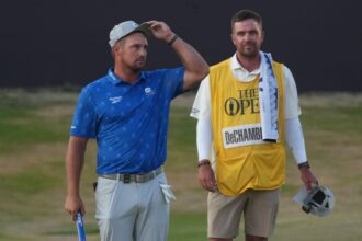 Bryson DeChambeau (left) and caddie Greg Bodine were frustrated by the two-shot penalty decision.