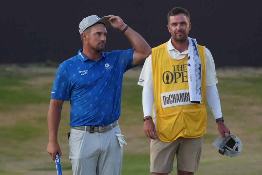 Bryson DeChambeau (left) and caddie Greg Bodine were frustrated by the two-shot penalty decision.