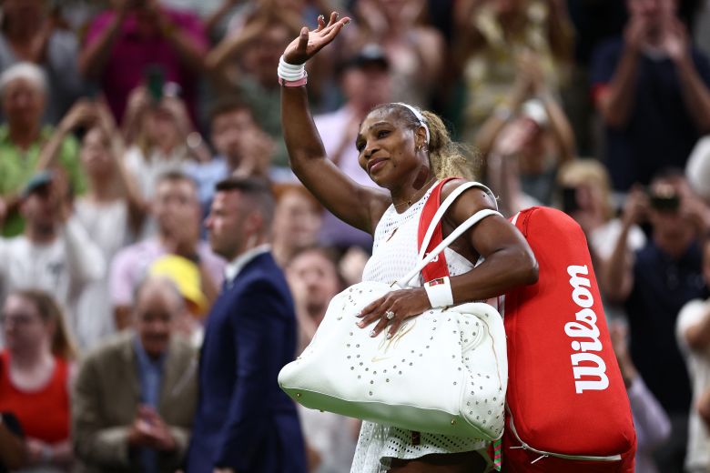 Williams waves to the crowd as she leaves the court.