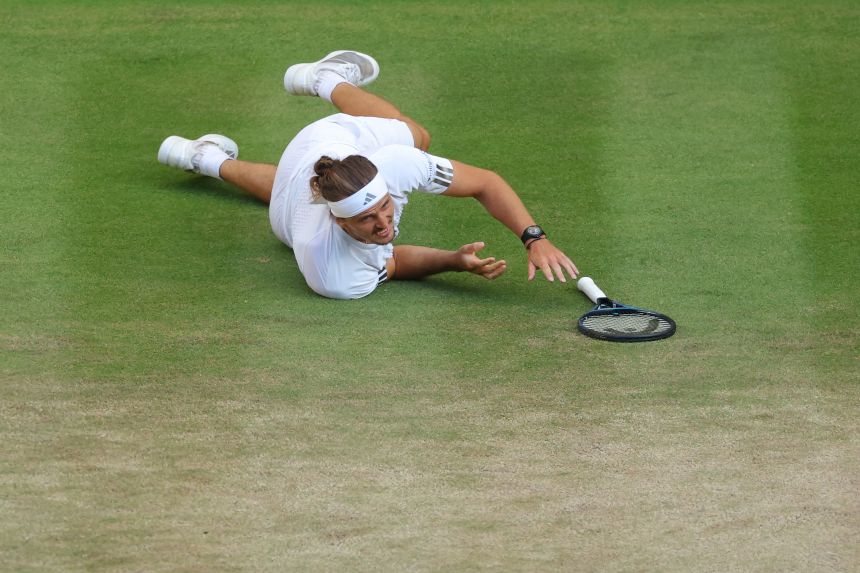 Alexander Zverev slips against Jannik Sinner.