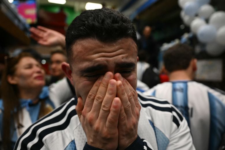 An Argentina fan cries after the end of the FIFA World Cup final match between Spain and Argentina at a bar in Buenos Aires, on July 19. Spain won by 1-0.