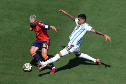 Dani Olmo of Spain (left) controls the ball against Cristian Romero of Argentina during the FIFA World Cup final on July 19.