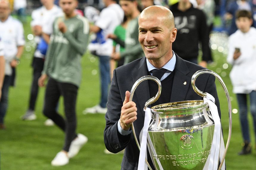 Zidane poses with the trophy after winning the Champions League title with Real Madrid in 2018.